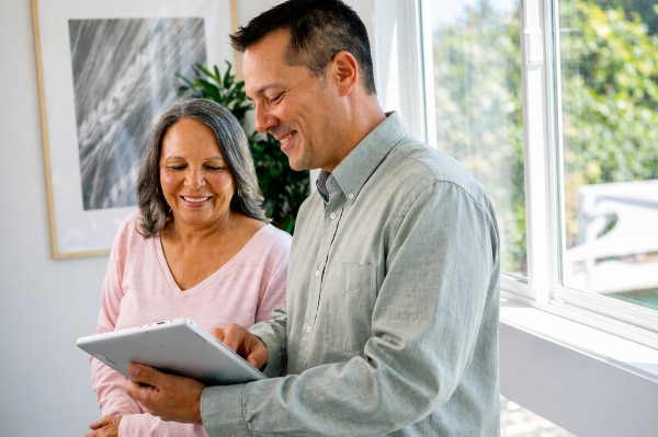  A doctor and a patient reviewing tablet together